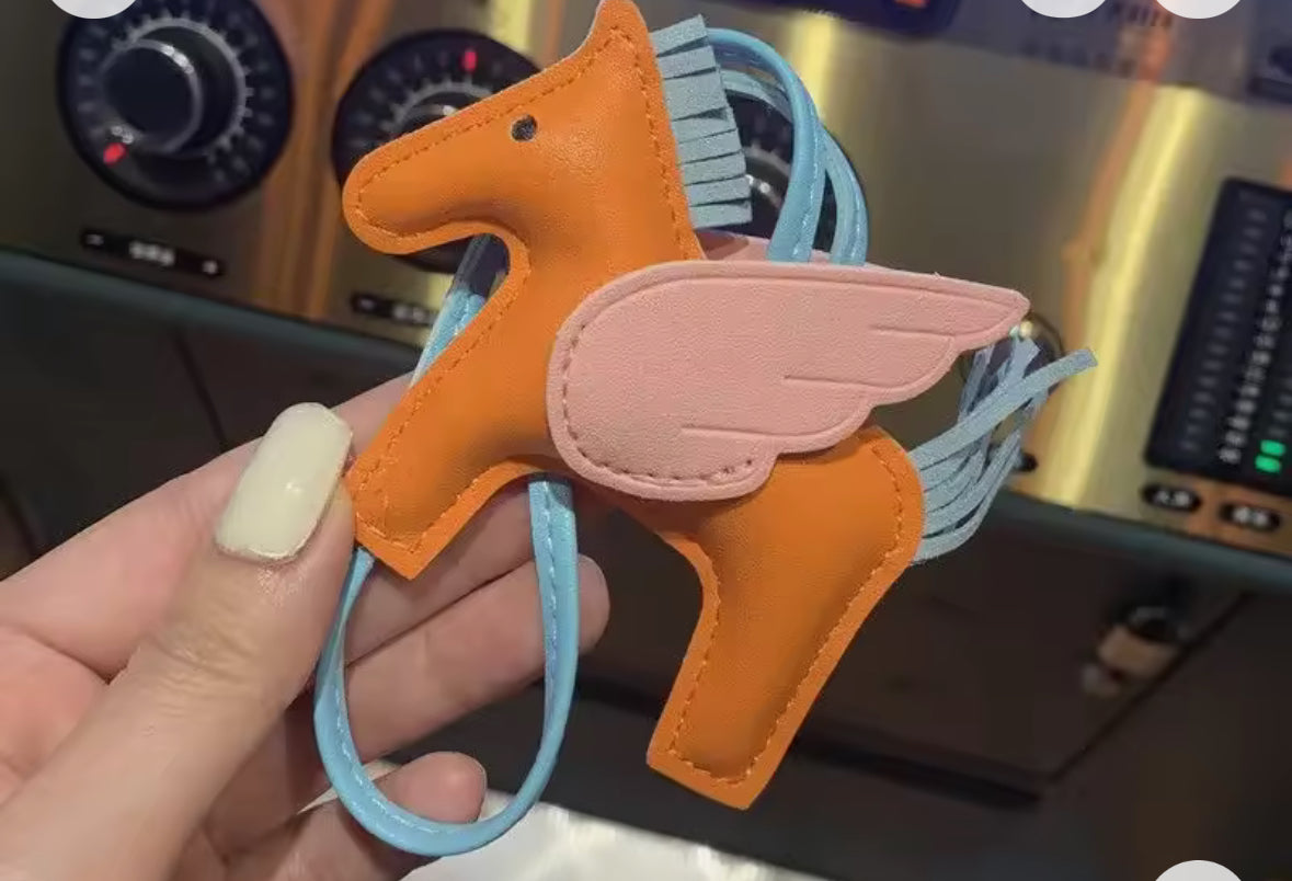 Charm para bolso caballitos naranja y azul