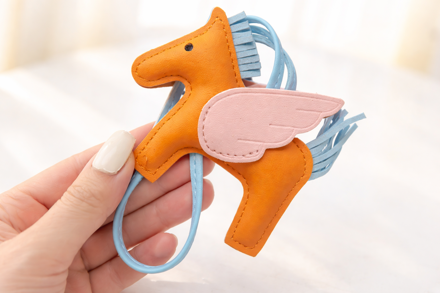 Charm para bolso caballitos naranja y azul